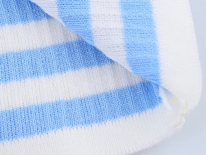 Macro detail showing high-quality blue and white striped knit texture and fabric fibers