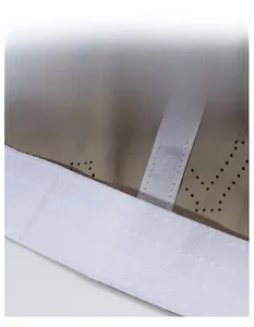 Detail of widened sweatband and laser-perforated breathable fabric on the baseball cap