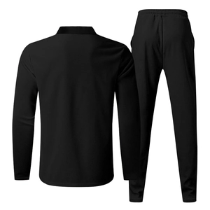 Rear view detail of men's black waffle knit two-piece leisure suit with long sleeve shirt