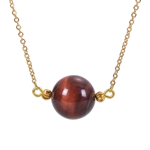 Close-up of 16mm tiger eye stone pendant on a delicate gold O-chain necklace