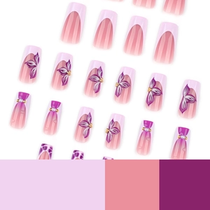 Pink and purple gradient press-on nails with 3D floral textures and pearl accents