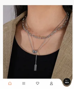 Double-layered stainless steel necklace featuring a luck bean pendant and Y-shaped chain