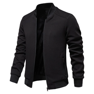 Close-up of black waffle texture fabric and metal zipper detail on casual jacket