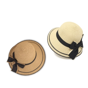 Women's wide brim straw sun hat with black bow and elegant ribbon decoration
