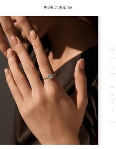 Gros plan d'une bague halo en argent S925 avec moissanite et motif floral étincelant