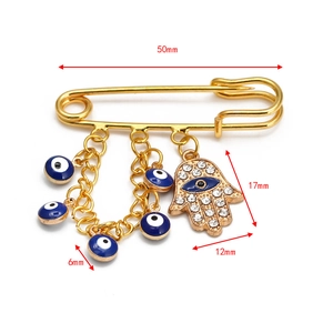 Detailed size view of a golden Hamsa Hand and Evil Eye brooch pin with dimensions