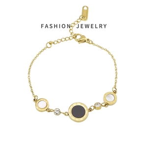 Elegant gold chain bracelet featuring Roman numeral discs and cubic zirconia stones