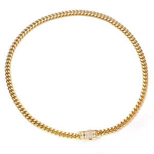 Detail of gold Cuban chain necklace with a rhinestone-encrusted box clasp on white back