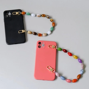 Colorful handmade beaded phone strap set with matte black and coral orange phone cases