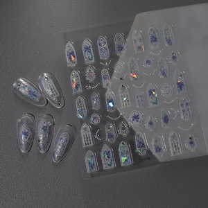 Detail of holographic nail art stickers with vintage stained glass tulip patterns
