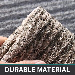 Close-up of durable grey PVC wire loop mat showing flexible texture and mesh structure