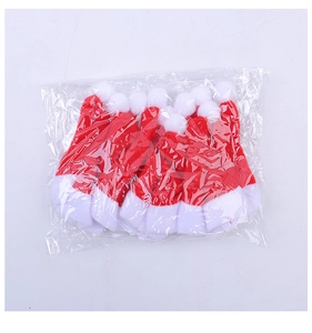 Pack of mini red and white felt Christmas hats for cutlery and bottles in plastic bag