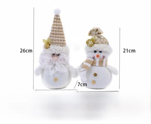 Detailed view of Christmas plush gnomes with red and gold fabric showing size specifications