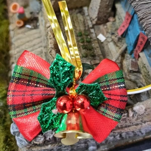 Red plaid Christmas bow with green leaves and red berries festive tree ornament
