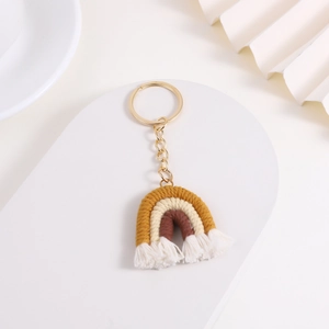 Handmade rainbow knitted keychain with yellow, beige and brown cotton cords on gold ring