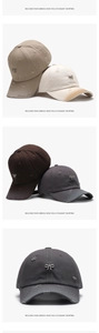 Close-up of baseball cap with distressed details, metal bow, and Brave Heart embroidery