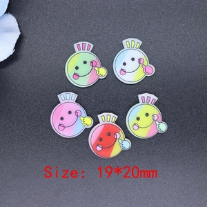 Flat lay of colorful 19x20mm resin smiley face charms for DIY crafts and phone cases