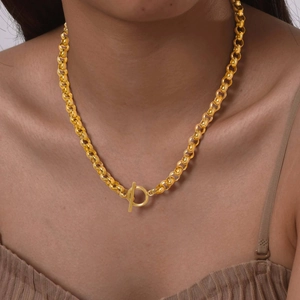 Gold stainless steel pearl chain necklace with OT toggle clasp worn by a fashion model