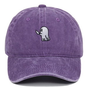 Close-up of ghost embroidery and washed cotton texture on a purple baseball cap
