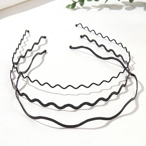 Set of minimalist black wavy metal headbands shown in a layered 45-degree angle view