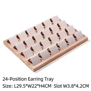 Detailed view of 24-slot wood earring display tray with dimensions 29.5x22x4cm