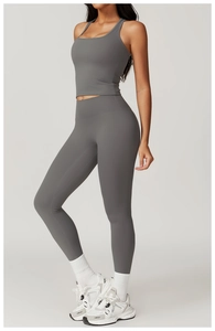 Detail view of deep grey high-waist yoga set showing seamless contour and compression fabric