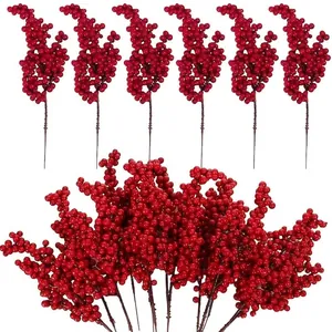 Vibrant red faux holly berry stems for festive home decoration and New Year arrangements