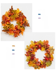 Detailed view of autumn wreath with maple leaves, berries and decorative pumpkins