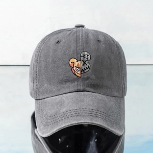 Vintage gray washed cotton baseball cap featuring split cartoon embroidery and curved brim