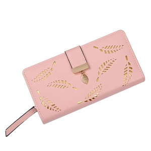 Pink women long wallet with hollow leaf design and gold metal pendant on white background