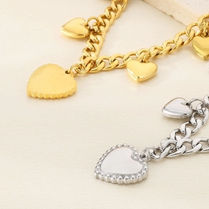 Punk style heart pendant chain necklace in gold and silver finish on stone base