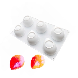 Detail view of 12-cavity banana silicone mold for mousse cakes with colorful finished samples