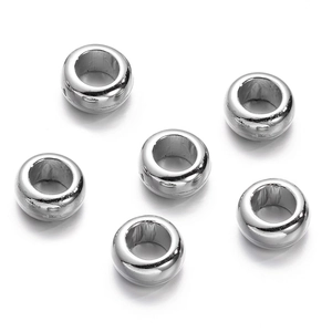 Detailed view of six silver polished CCB spacer beads for DIY jewelry making