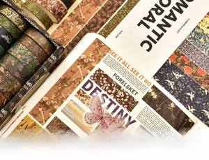 Detail of vintage washi tape set featuring floral patterns and collage scrapbook samples