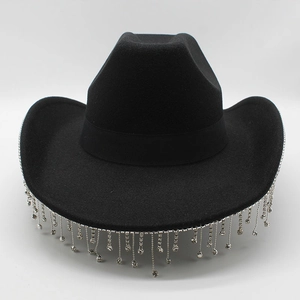 Detailed view of black cowboy hat with shimmering silver rhinestone fringe along the brim