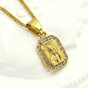 Macro shot of 316L gold-plated Virgin Mary pendant necklace with cubic zirconia