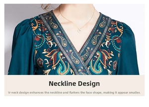 Detail of V-neckline with ethnic paisley print and smooth fabric on green dress