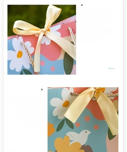 Detail of 250g premium white cardstock gift bag with floral patterns and yellow ribbon