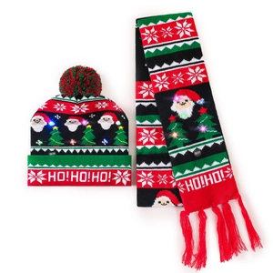 Detail of LED light-up Christmas knitted hat and scarf set with HO!HO!HO! patterns