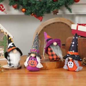 Set of four Halloween gnome plush dolls with wizard hats and pumpkin decor by a fireplace