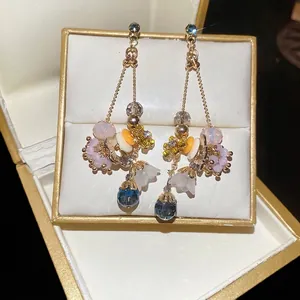 Elegant silver needle earrings with blue crystal pendant and vintage floral crystal design