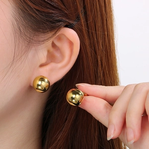 Polished 18k gold plated stainless steel ball stud earrings worn for size display