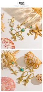 Detail of 14K gold marine jewelry set with starfish, dolphins and turquoise stones