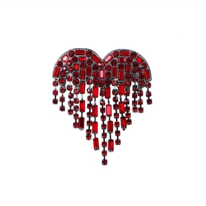 Luxury red heart brooch with tassels and sparkling rhinestones on white background