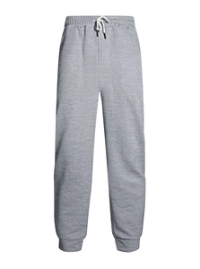 Detail of grey men's joggers showing unique 3D geometric quilted texture and white drawstring