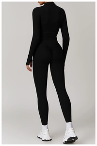 Rear view of slim fit black yoga set with ruched leggings for butt lifting effect