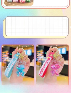 Detail of blue and pink liquid bear keychains with glitters and Good Luck straps