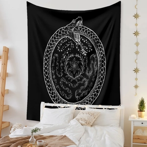 Detail of bohemian black and white tapestry with mystical celestial and floral patterns