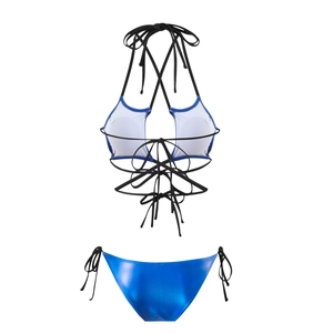 Detail of metallic blue bikini bottom with white top featuring crisscross tie straps