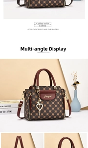 Macro detail of dark brown patterned leather bag with heart pearl charm and gold hardware